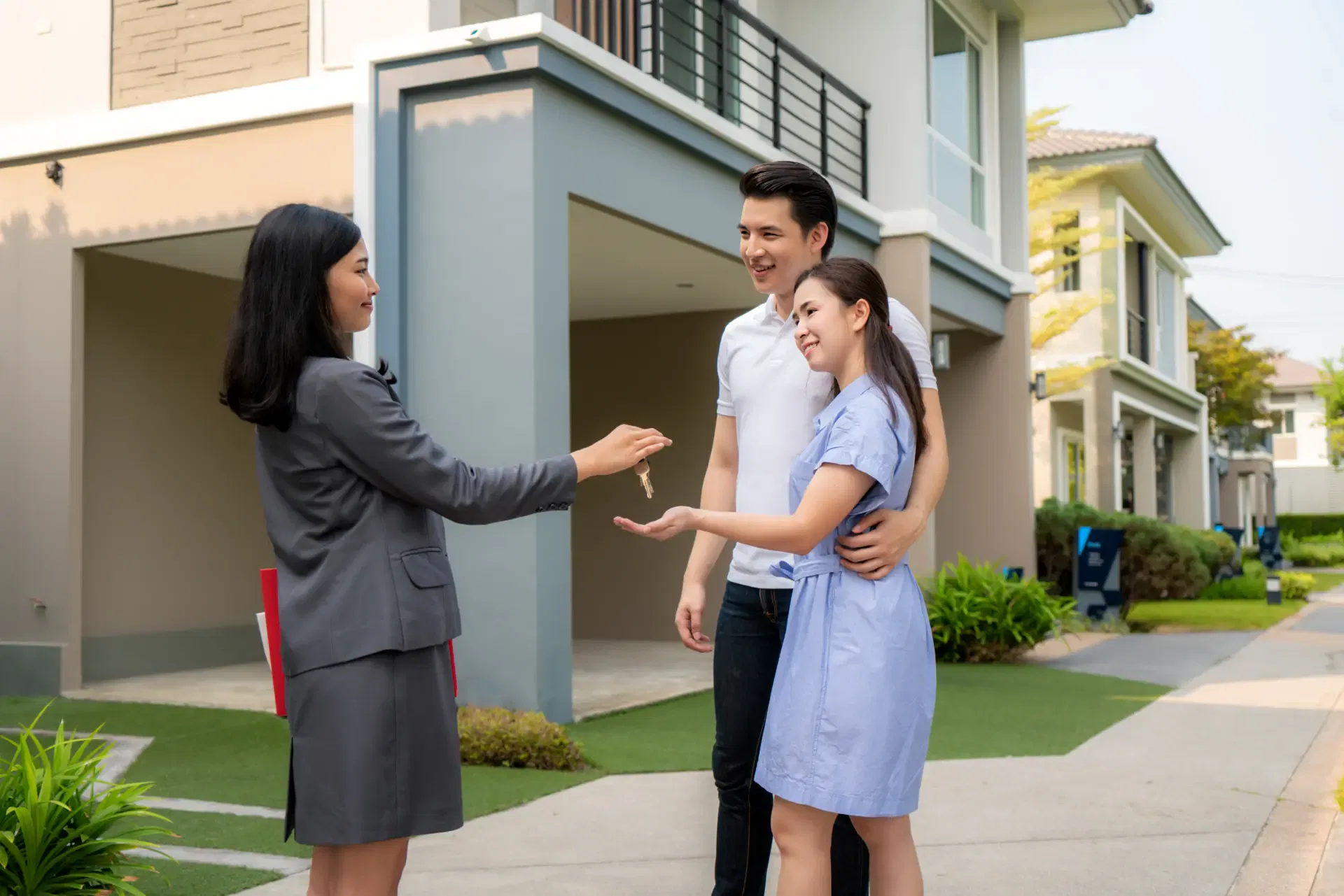happy-smile-young-couple-take-keys-new-big-house-from-real-estate-agent